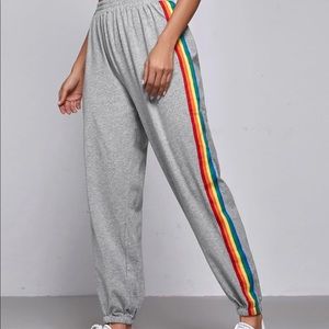 Gray drawstring sweatpants with rainbow stripe